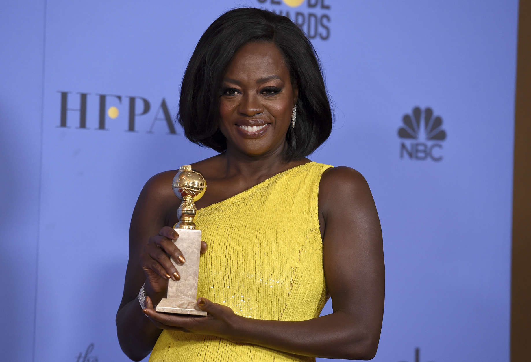 Viola Davis poses in the press room with the award for best performance by an actress in a supporting role in any motion picture for "Fences" at the 74th annual Golden Globe Awards at the Beverly Hilton Hotel on Sunday, Jan. 8, 2017, in Beverly Hills, Calif. (Photo by Jordan Strauss/Invision/AP)
