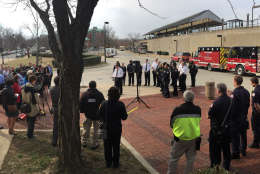 "All of these individuals worked together as a shining example of how to work together in a system to save lives," said Alexandria Fire Chief Robert C. Dubé at a news conference where Metro Transit Officer Leanne Dill and Debora Anderson, of Lorton, received commendations. Also pictured are some of the Alexandria firefighters and paramedics on hand that day. (WTOP/Kristi King)