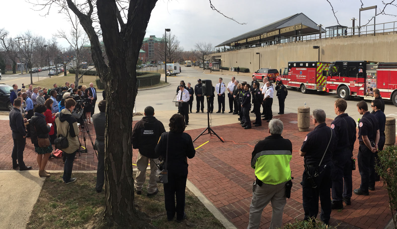 "All of these individuals worked together as a shining example of how to work together in a system to save lives," said Alexandria Fire Chief Robert C. Dubé at a news conference where Metro Transit Officer Leanne Dill and Debora Anderson, of Lorton, received commendations. Also pictured are some of the Alexandria firefighters and paramedics on hand that day. (WTOP/Kristi King)