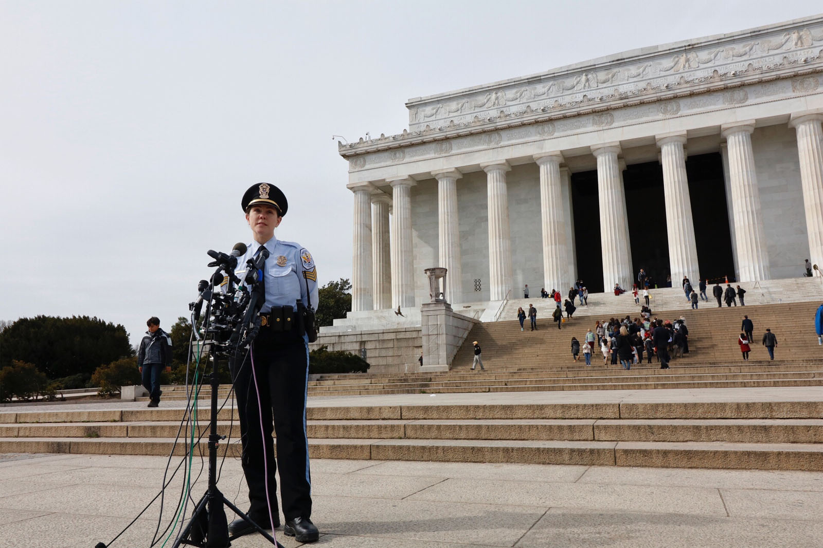 U.S. Park Police spokeswoman Anna Rose speaking to reporters in front of the Lincoln Memorial, one of three monuments where the graffiti appeared. (WTOP/Kate Ryan)