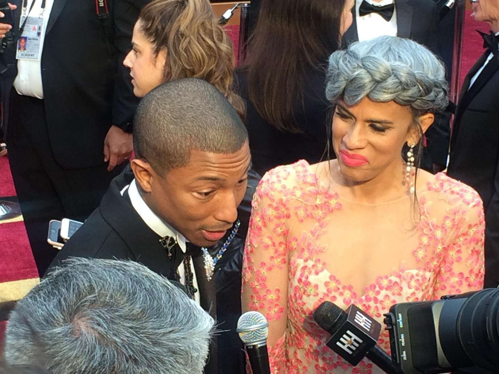 Pharrell Williams answers questions on the red carpet. (WTOP/Jason Fraley)