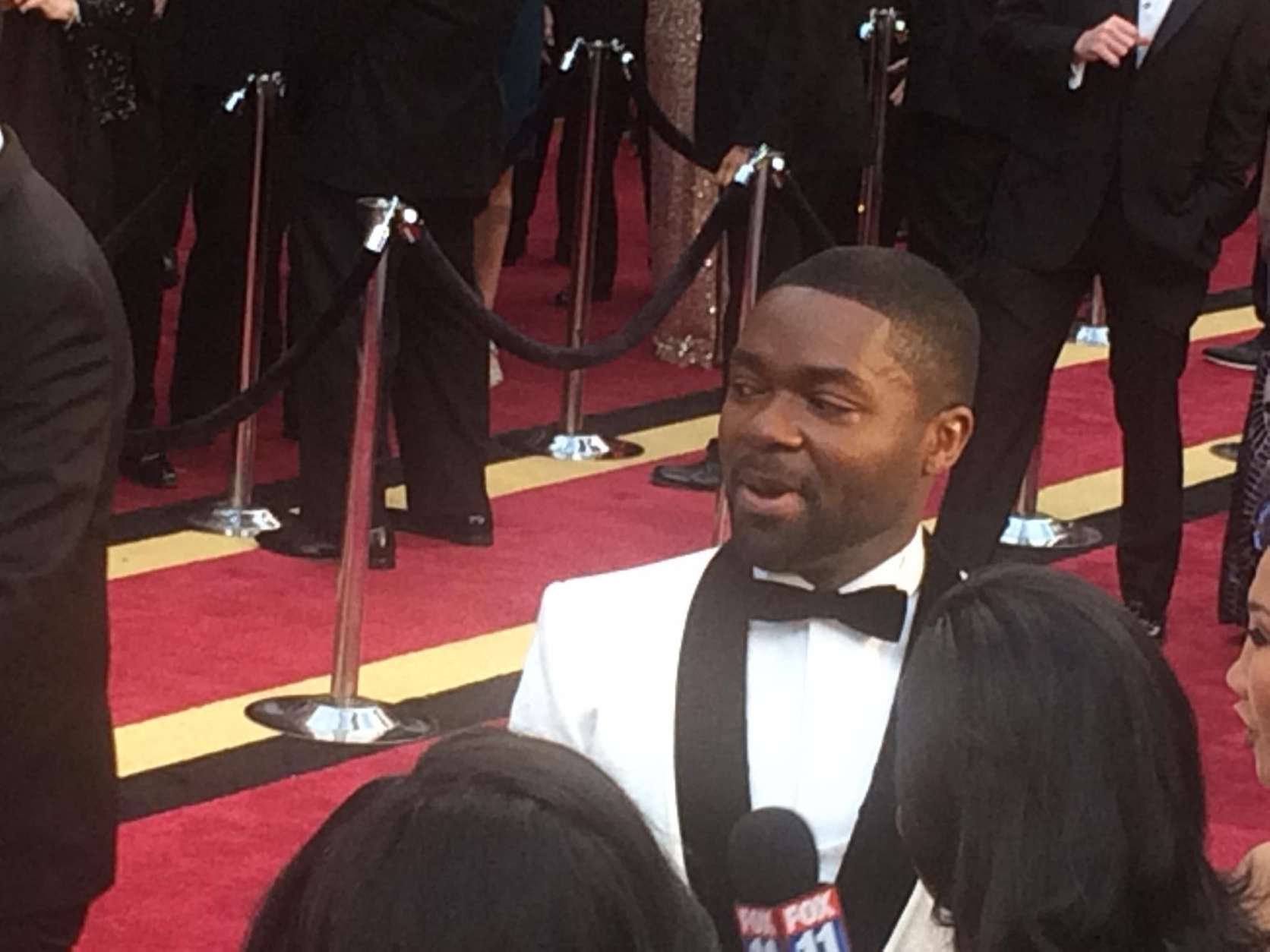 David Oyelowo answers questions on the red carpet. (WTOP/Jason Fraley)