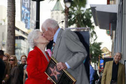 Judge Joseph Wapner, former host of the television series "The People's Court" gets a kiss from his wife, Mickey, as he is honored with a star on the Hollywood Walk of Fame in Los Angeles, on Thursday, Nov. 12, 2009. Best known for his 13 years presiding on the hit television show "The People's Court," Judge Wapner's distinguished career spans more than half a century and includes a military service, judicial career, entertainment and many philanthropic organizations. (AP Photo/Damian Dovarganes)
