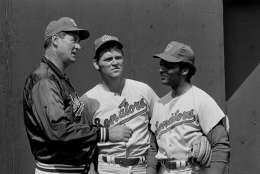 Ted Williams, left, manager of the Washington Senators, holds a private conference with his new additions to the club, Denny McLain, center, and Curt Flood, right, at spring training camp in Pompano Beach, Fla., Feb. 26, 1971. (AP Photo/Robert Houston)