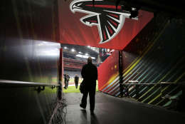 Atlanta Falcons head coach Dan Quinn walks down the team's tunnel to the field during a walk through at NRG Stadium on the eve of NFL Super Bowl 51 football game Saturday, Feb. 4, 2017, in Houston. Atlanta will face the New England Patriots in the Super Bowl Sunday. (AP Photo/Eric Gay)