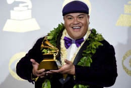 Kalani Pe'a poses in the press room with the award for best regional roots music album for "E Walea" at the 59th annual Grammy Awards at the Staples Center on Sunday, Feb. 12, 2017, in Los Angeles. (Photo by Chris Pizzello/Invision/AP)