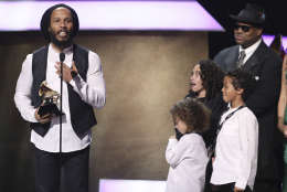 Ziggy Marley, left, accepts the award for best reggae album for "Ziggy Marley" at the 59th annual Grammy Awards on Sunday, Feb. 12, 2017, in Los Angeles. Abraham Selassie Robert Nesta Marley, Gideon Robert Nesta Marley, Judah Victoria Marley, and Jimmy Jam look on from right. (Photo by Matt Sayles/Invision/AP)
