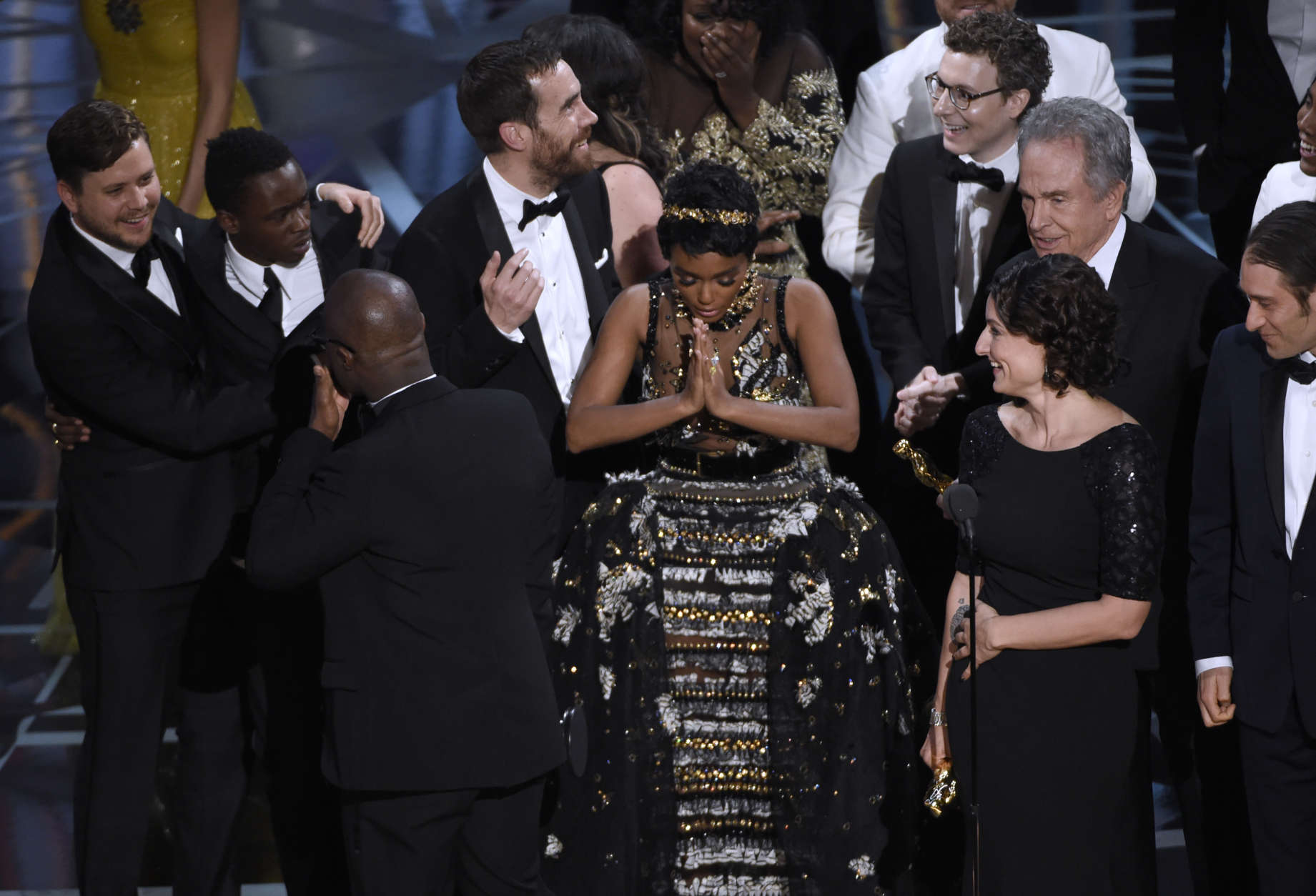 Janelle Monae, center, reacts as "Moonlight" is announced as the winner of best picture at the Oscars on Sunday, Feb. 26, 2017, at the Dolby Theatre in Los Angeles. (Photo by Chris Pizzello/Invision/AP)