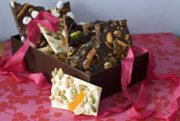 In this image taken on Jan. 21, 2013, four variations of Valentine's Day chocolate bark are shown in Concord, N.H. You can top the chocolate with whatever your love loves.(AP Photo/Matthew Mead)