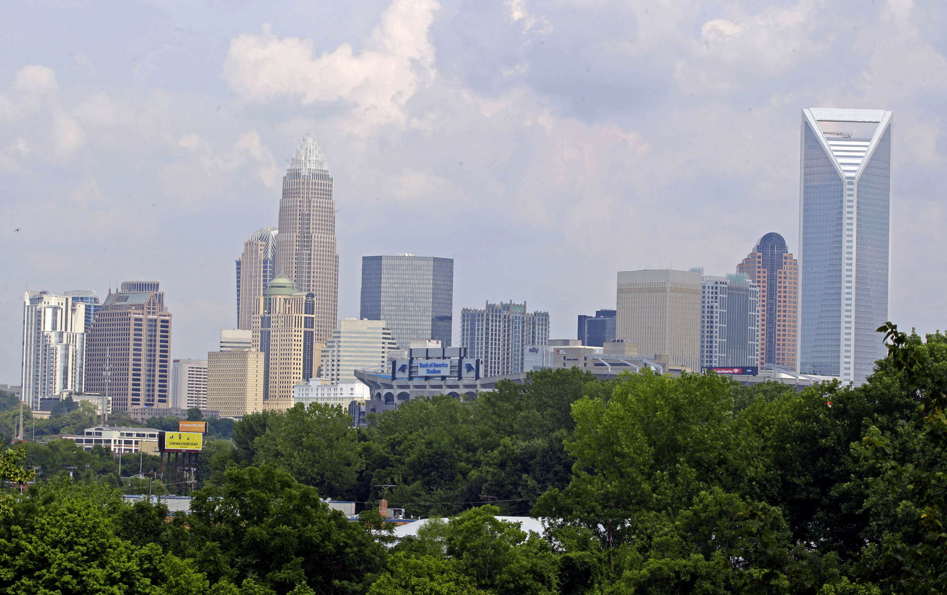 In this July 17, 2012 photo the skyline of Charlotte, N.C., is shown. Much was made about Charlotte emerging on the big stage when Democrats awarded their 2012 national convention to the city last year. But the tidy city of gleaming skyscrapers built with money during the flush years of banking is more in its middle age, trying to reinvent itself without cutting all the ties to its big cash past. (AP Photo/Chuck Burton)
