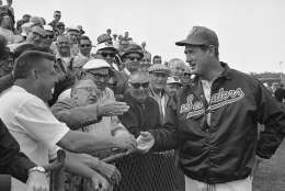 Ted Williams, the new manager of the Washington Senators, greets baseball fans who were on hand in Pompano Beach, Fla., Feb. 25, 1969, when Williams made his first appearance in his new role. The fans gave Williams a big round of applause when he stopped by to say hello. (AP Photo/Robert H. Houston)