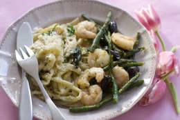 This Jan. 13, 2014 photo shows honey peppered roasted shrimp with green beans and olives in Concord, N.H. (AP Photo/Matthew Mead)