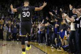Golden State Warriors' Stephen Curry (30) gestures as fans cheer a score against the Phoenix Suns during the second half of an NBA basketball game Saturday, Dec. 3, 2016, in Oakland, Calif. (AP Photo/Ben Margot)