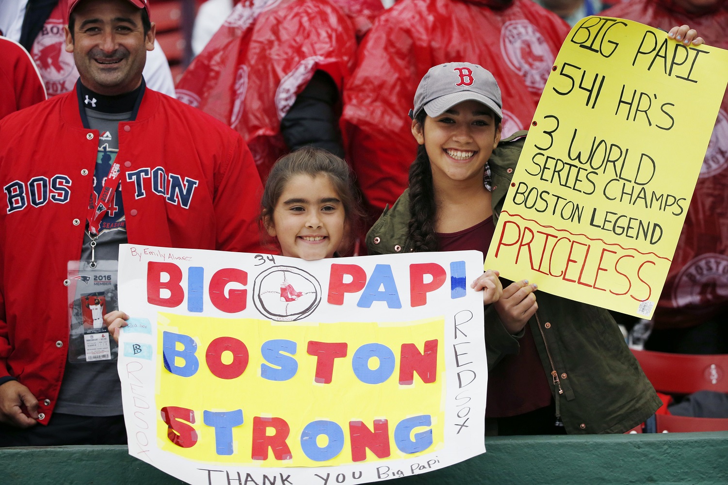 Fans hold signs during ceremonies ton honor Boston Red Sox's David Ortiz before a baseball game against the Toronto Blue Jays in Boston, Sunday, Oct. 2, 2016. (AP Photo/Michael Dwyer)