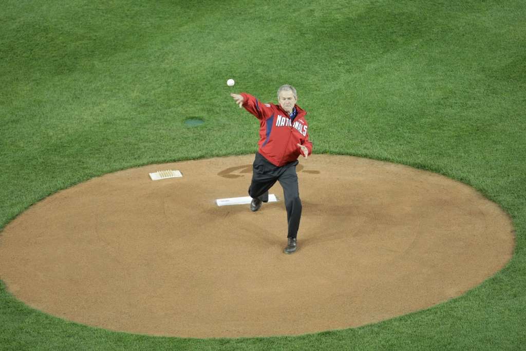 Former President George W. Bush throws the first pitch on opening day in 2008 at Nationals Park.  (Getty Images/Drew Hallowell)