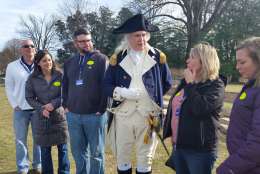 The actor playing George Washington takes photos with guests at the Mount Vernon George Washington celebration. (WTOP/Kathy Stewart)