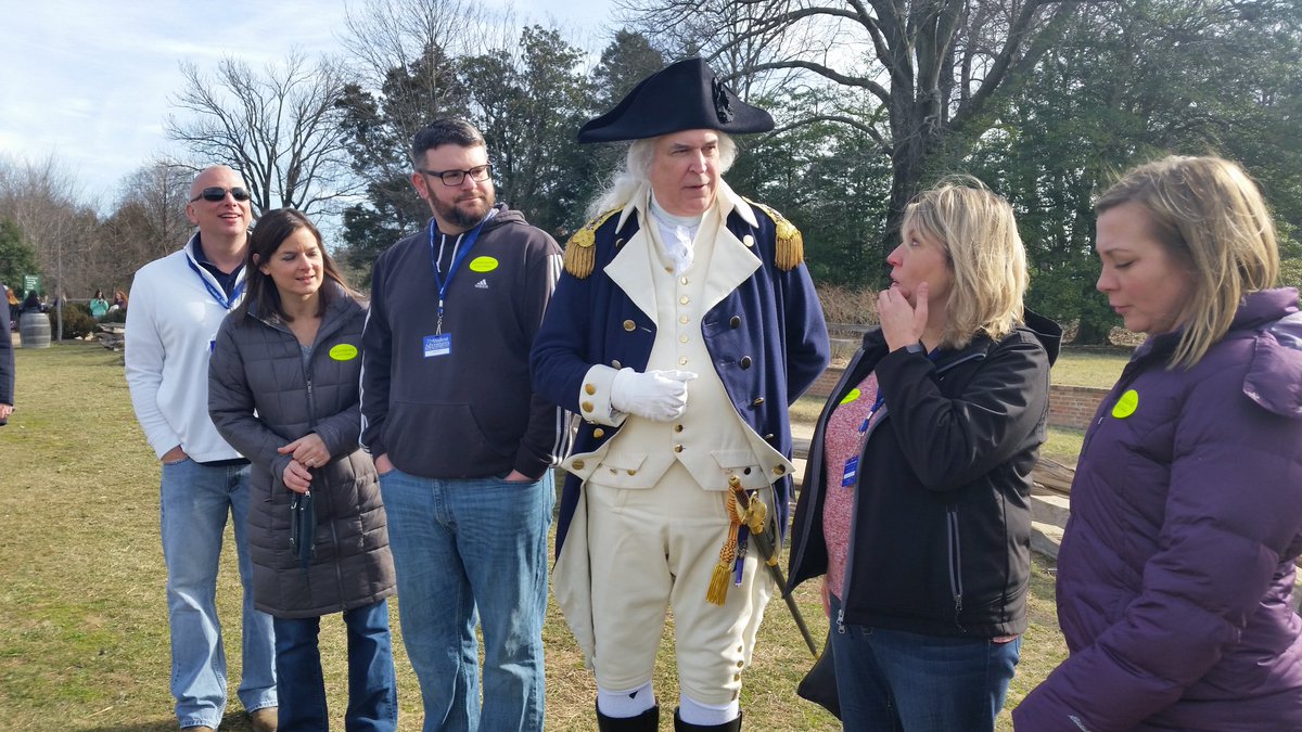 The actor playing George Washington takes photos with guests at the Mount Vernon George Washington celebration. (WTOP/Kathy Stewart)