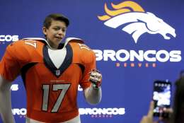 A fan takes a photo at the Denver Broncos display at the NFL Experience on Sunday, January 29, 2017 in Houston, TX. (AP Photo/Gregory Payan)