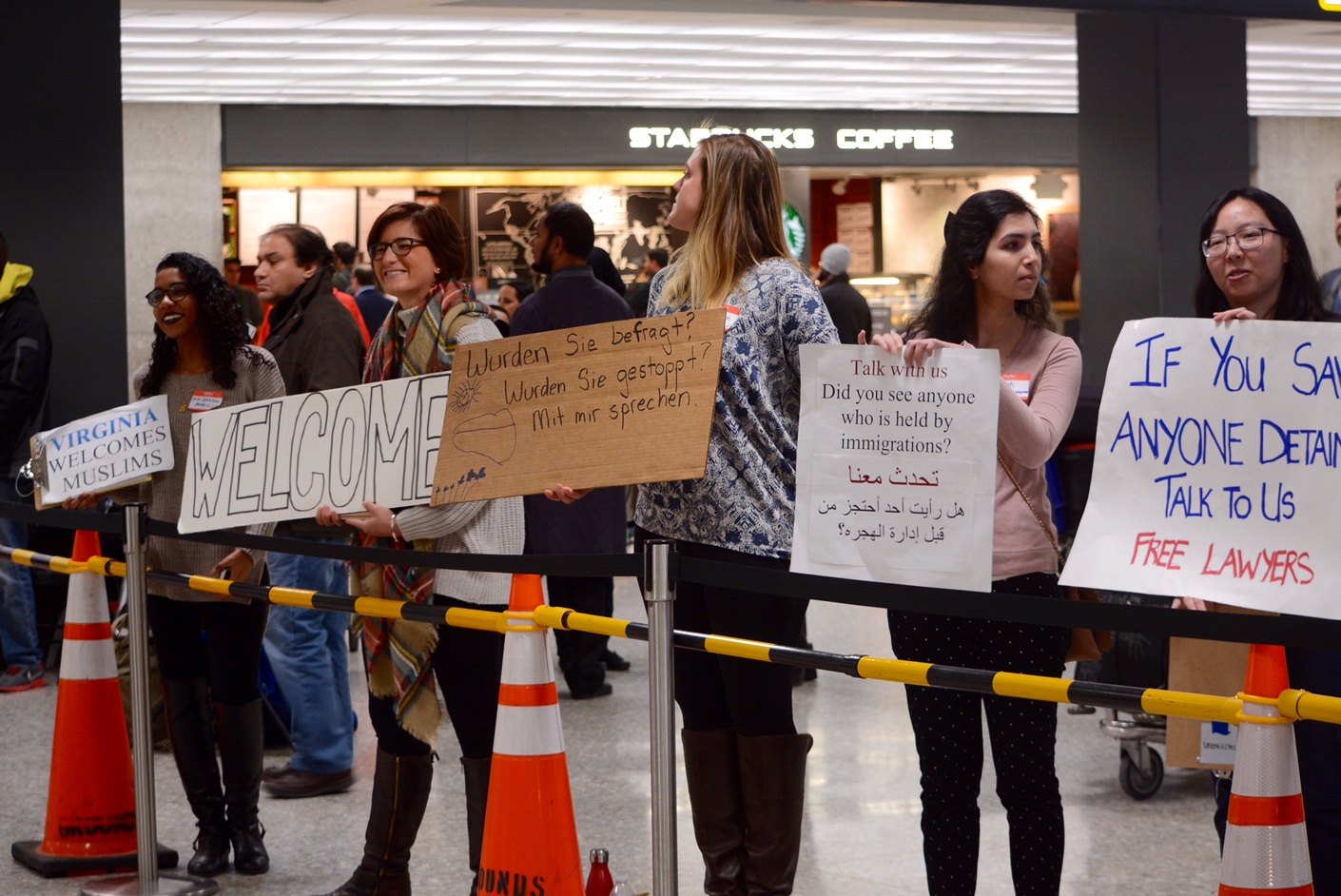 Lawyers and protesters continued their vigil at Dulles International Airport on Saturday, Feb. 4, 20167 in protest of President Donald Trump's travel ban. (WTOP/Dave Dildine)