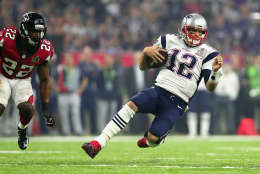 HOUSTON, TX - FEBRUARY 05:  Tom Brady #12 of the New England Patriots runs for a first down against the Atlanta Falcons in the third quarter during Super Bowl 51 at NRG Stadium on February 5, 2017 in Houston, Texas.  (Photo by Tom Pennington/Getty Images)