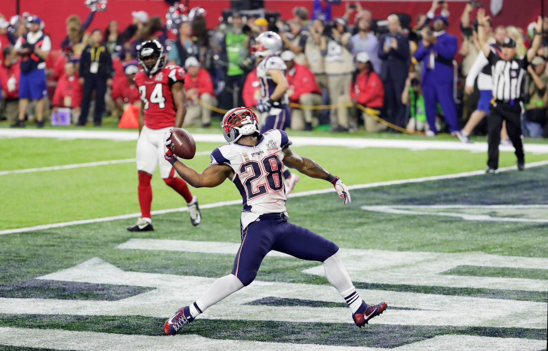 HOUSTON, TX - FEBRUARY 05:  James White #28 of the New England Patriots celebrates rushing for a 1-yard touchdown in the fourth quarter against the Atlanta Falcons during Super Bowl 51 at NRG Stadium on February 5, 2017 in Houston, Texas.  (Photo by Jamie Squire/Getty Images)