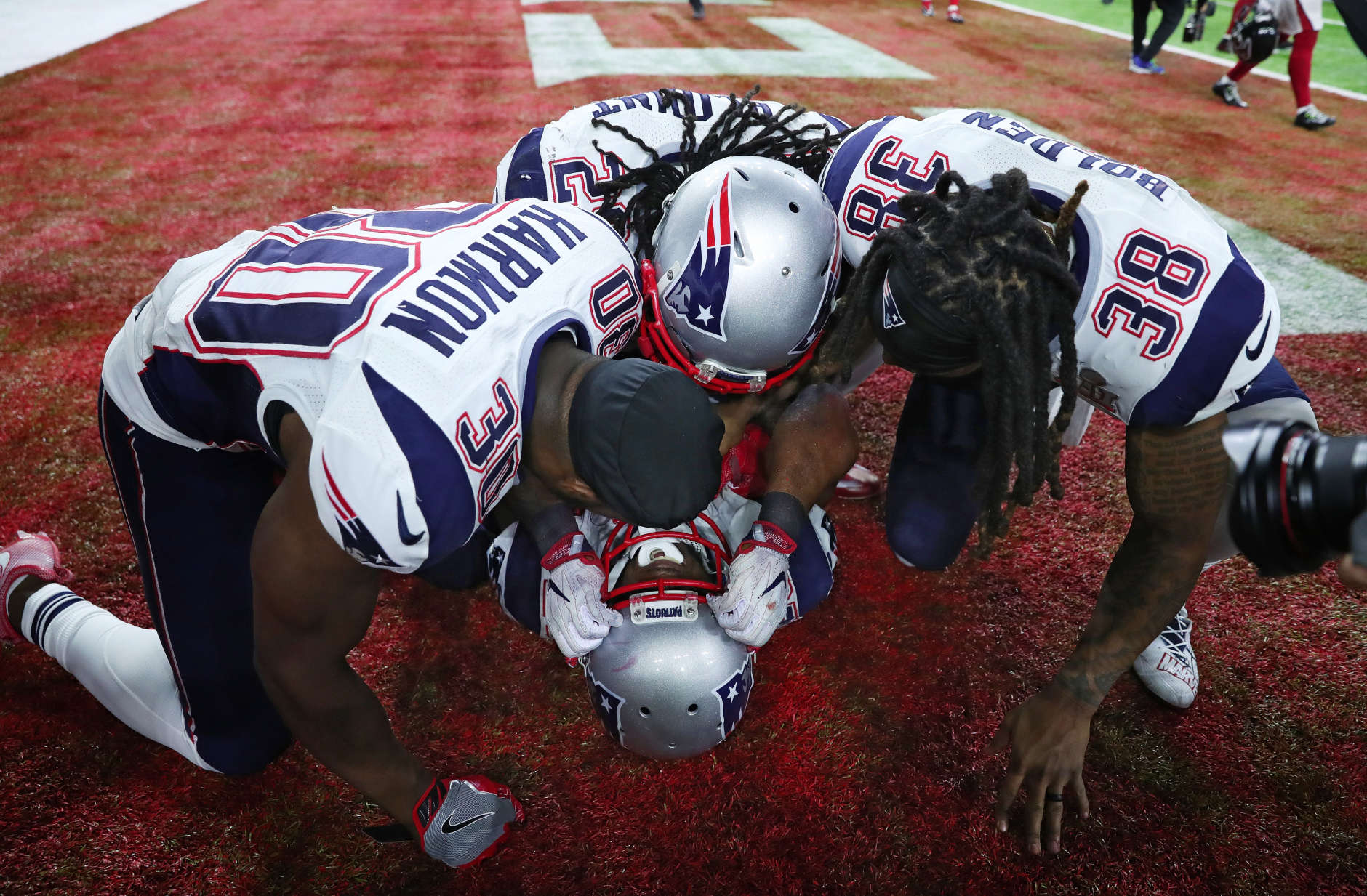 HOUSTON, TX - FEBRUARY 05:  James White #28 of the New England Patriots celebrates with teammates after defeating the Atlanta Falcons 34-28 in overtime to win Super Bowl 51 at NRG Stadium on February 5, 2017 in Houston, Texas.  (Photo by Tom Pennington/Getty Images)