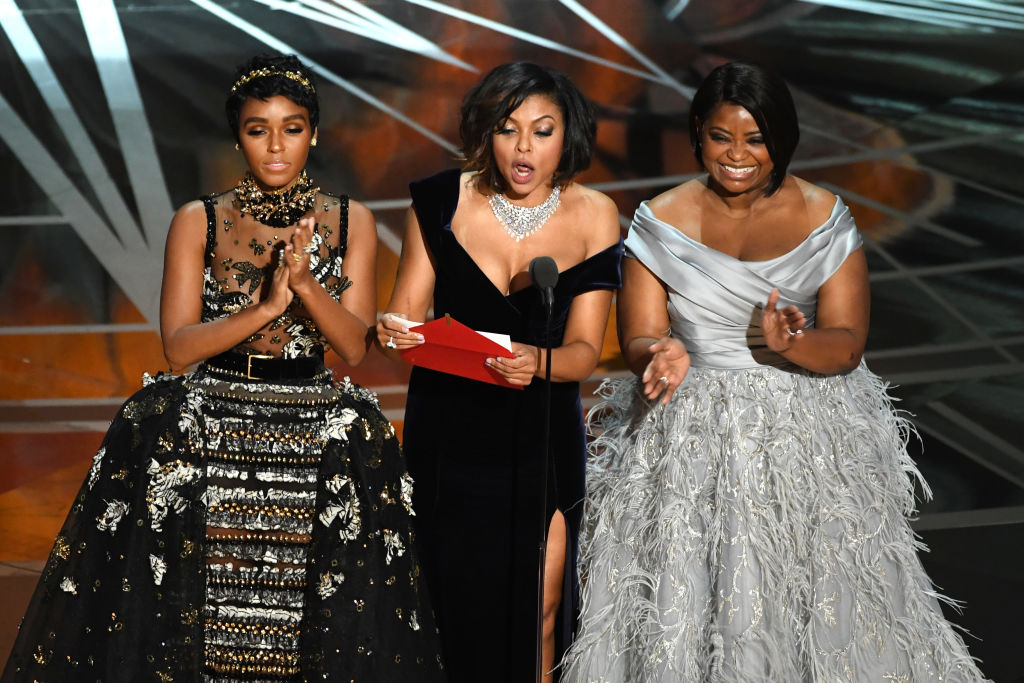 (L-R) Actors Janelle Monae, Taraji P. Henson and Octavia Spencer speak onstage during the 89th Annual Academy Awards at Hollywood & Highland Center on February 26, 2017 in Hollywood, California. (Photo by Kevin Winter/Getty Images)
