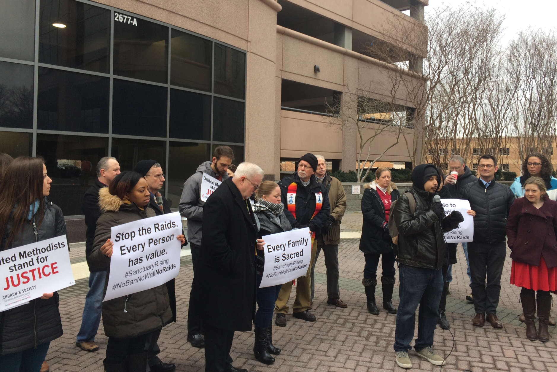 Picture of protesters outside the Immigration and Customs Enforcement's office in Fairfax, virginia.