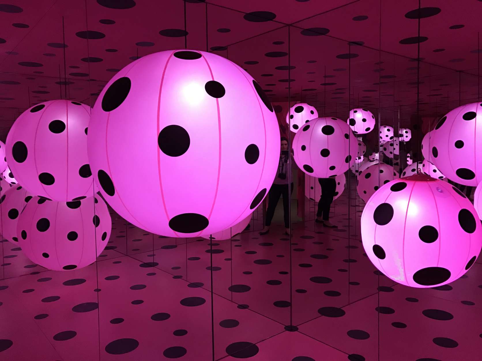 Another room contains a giant polka dotted orb which visitors can walk into where they'll find another mirrored room. (WTOP/Megan Cloherty)