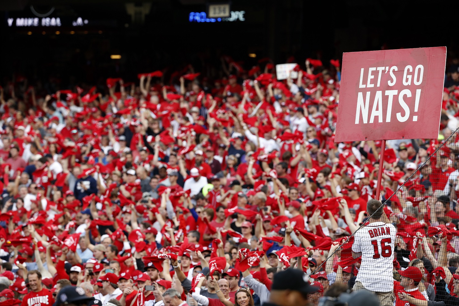 Washington Nationals fans cheer at the start of Game 1 of baseball's National League Division Series between the Washington Nationals and the Los Angeles Dodgers, at Nationals Park, Friday, Oct. 7, 2016, in Washington. (AP Photo/Alex Brandon)