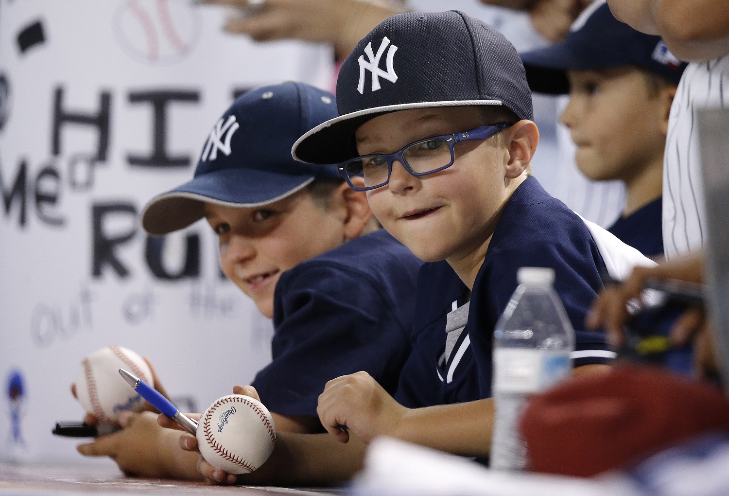 New York Yankees fans watch Yankees players warm up prior to a baseball game against the Arizona Diamondbacks Tuesday, May 17, 2016, in Phoenix. (AP Photo/Ross D. Franklin)
