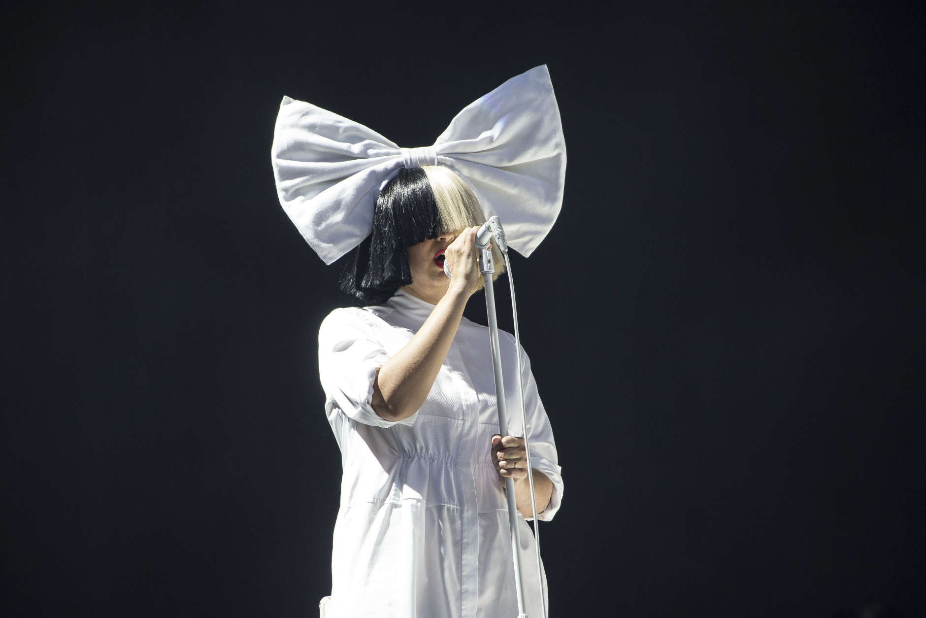 Singer Sia performs as part of the V Festival at Hylands Parks, Chelmsford, Saturday, Aug 20, 2016. (Joel Ryan/Invision/AP)