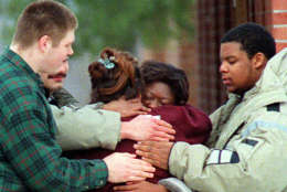 Some of the members of the Job Corps center near Harpers Ferry, W. Va. console one another Saturday, Feb. 17, 1996. All 17 passengers aboard a MARC commuter train were Job Corps members traveling for a long weekend when it collided with an Amtrak passenger train in Silver Spring, Md. Friday evening, Feb. 16, 1996. (AP Photo/J. Scott Applewhite)