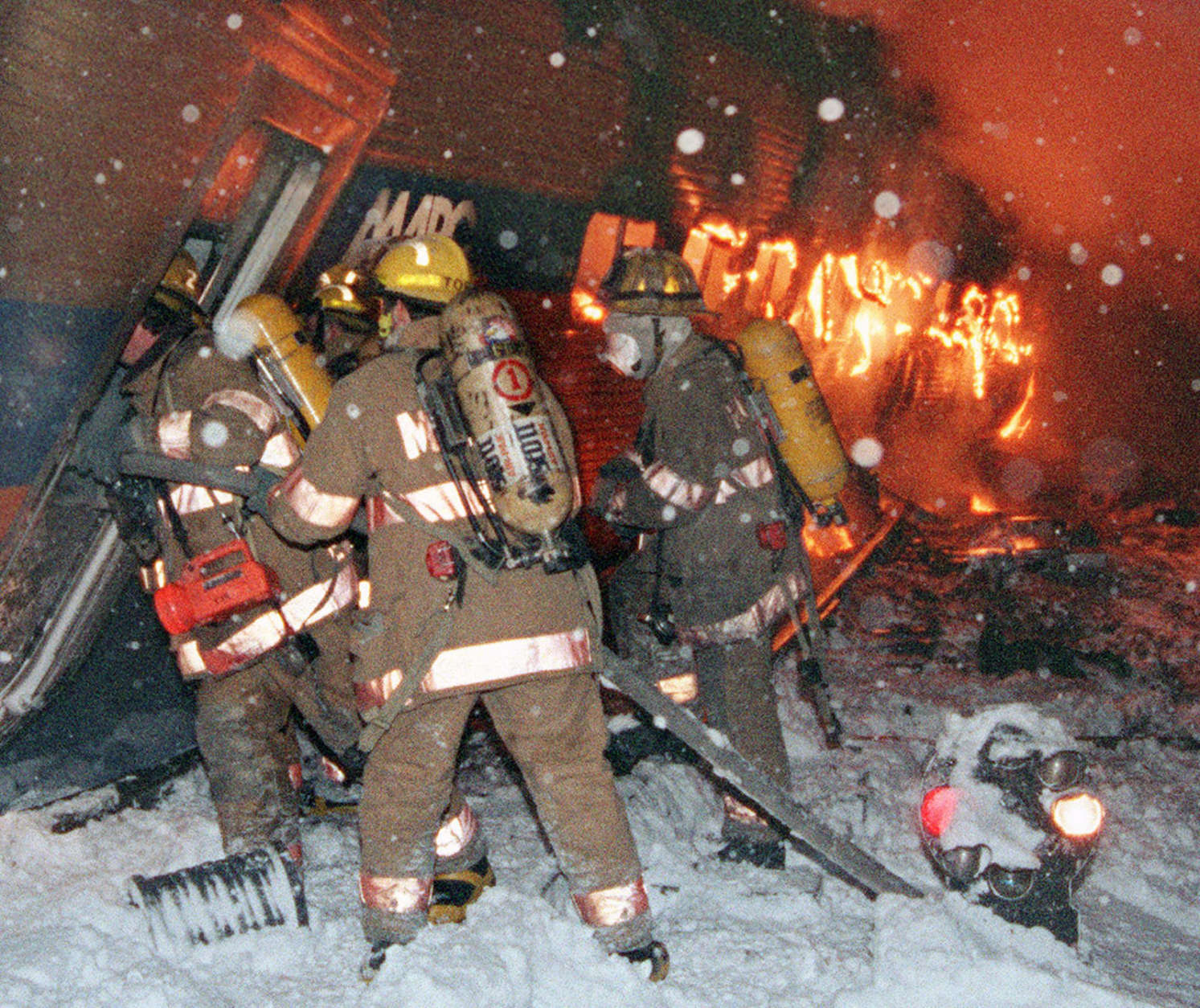 Firefighters look for passengers aboard a MARC commuter train Friday Feb. 16, 1996 in Silver Spring, Md. after a train collision. Amtrak's Capital Limited train on a run between Chicago and Washington collided with another train. (AP Photo/Henrik G. de Gyor)