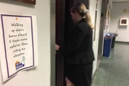 A worker in the Montgomery County Council Office Building in Rockville chooses to take the elevator despite a sign suggesting otherwise. "One of my favorite Spanish words is the word 'bienestar,'" Montgomery County Council member George Leventhal said at a news conference proposing new vending machine rules. "'Bienestar' — 'well-being,' and that is what we seek for Montgomery County." (WTOP/Kristi King)