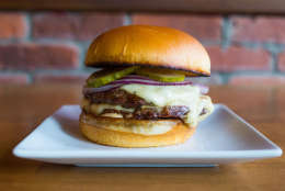 At Red Apron Burger Bar in Dupont Circle, customers can build their burgers using one of two meats: a grass-fed, grain-finished Black Angus beef or a grass-fed, grass-finished Ancient White Park beef — all of which are sourced from Virginia cattle farmers. (Courtesy Neighborhood Restaurant Group/Red Apron Burger Bar)
