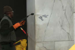 A worker sprays graffiti at the Lincoln Memorial on Tuesday. (Photo courtesy National Park Service)