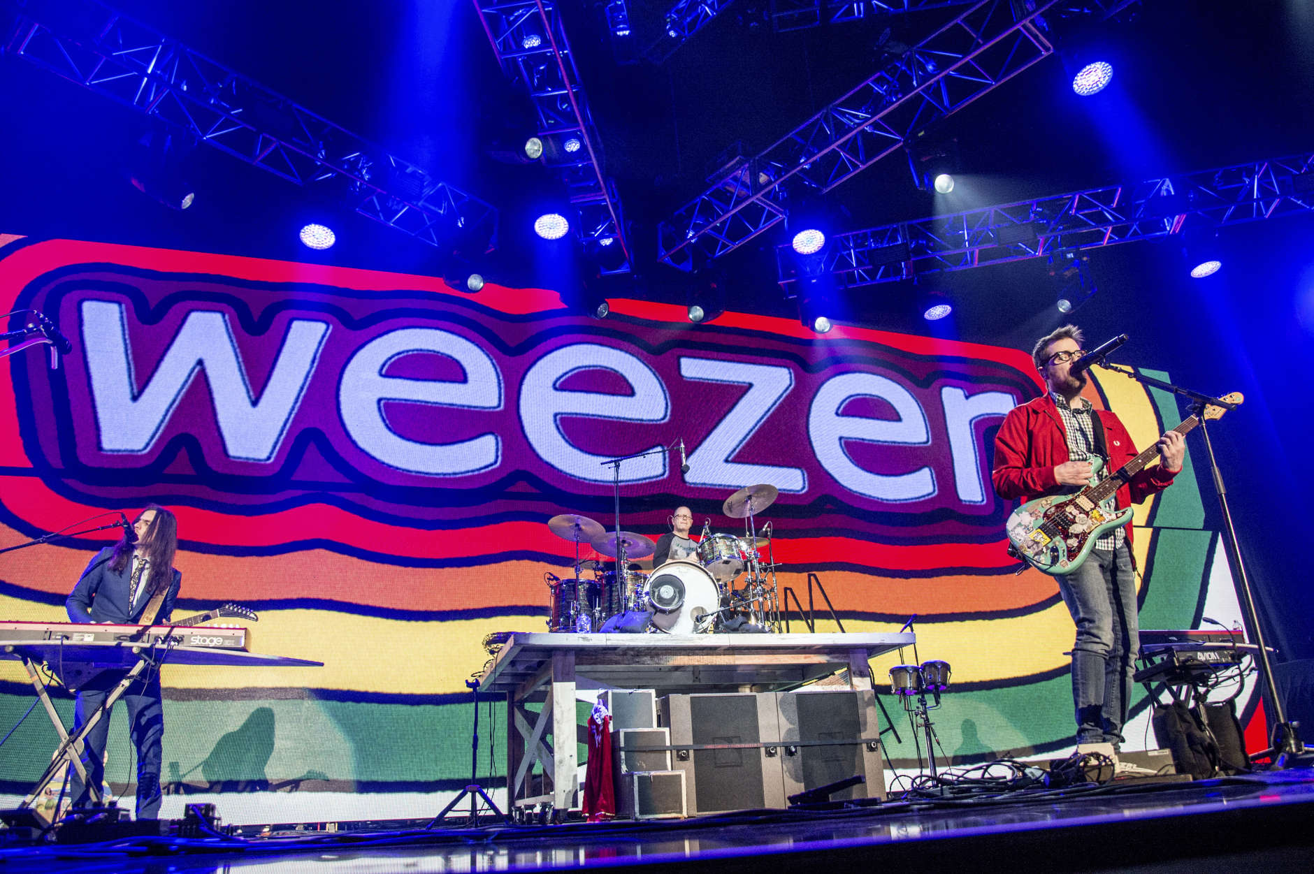 Brian Bell, from left, Patrick Wilson, Rivers Cuomo, and Scott Shriner of Weezer perform at the 2016 KROQ Almost Acoustic Christmas at The Forum on Sunday, Dec. 11, 2016, in Inglewood, Calif. (Photo by Amy Harris/Invision/AP)