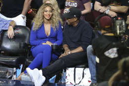 Beyonce and Jay Z watch during the first half of Game 6 of basketball's NBA Finals between the Cleveland Cavaliers and Golden State Warriors in Cleveland, Thursday, June 16, 2016. (AP Photo/Ron Schwane)
