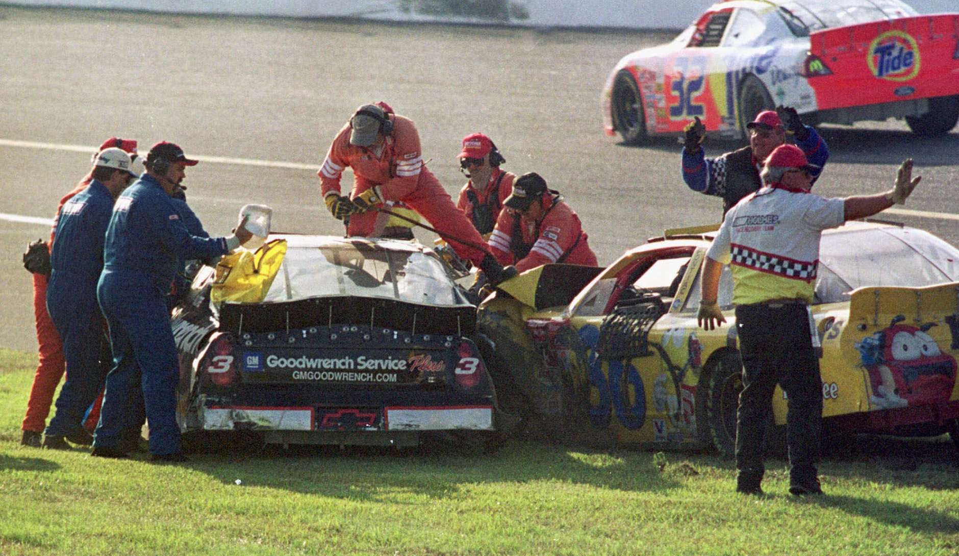 Workers try to remove Dale Earnhardt (3) from his vehicle after a crash also involving Ken Schrader (36) during the Daytona 500 in this Feb. 18, 2001photo at the Daytona International Speedway in Daytona Beach, Fla. Earnhart was killed in the crash. (AP Photo/Greg Suvino)