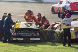 Workers try to remove Dale Earnhardt (3) from his vehicle after a crash also involving Ken Schrader (36) during the Daytona 500 in this Feb. 18, 2001photo at the Daytona International Speedway in Daytona Beach, Fla. Earnhart was killed in the crash. (AP Photo/Greg Suvino)