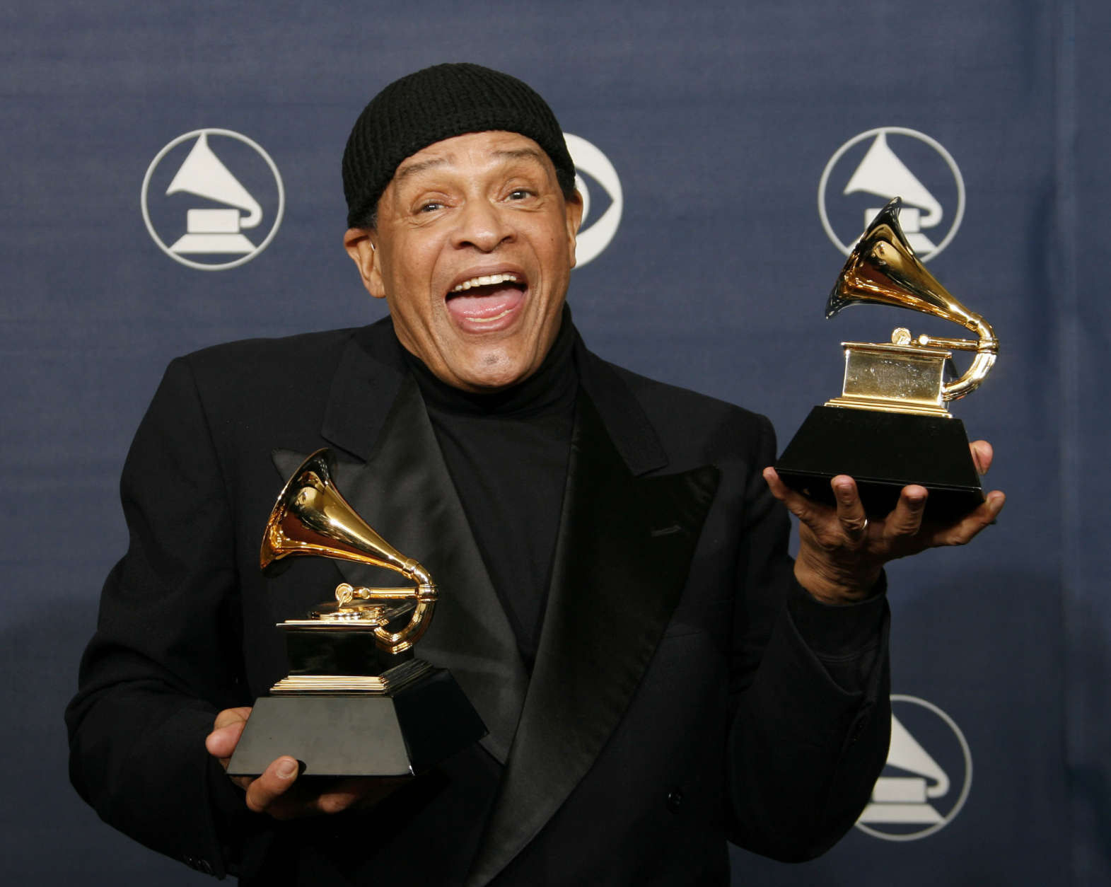 FILE - In this Sunday, Feb. 11, 2007, file photo, Al Jarreau poses with his awards for best pop instrumental performance for "Mornin'" and best traditional R&amp;B vocal performance for "God Bless the Child" at the 49th Annual Grammy Awards in Los Angeles. Jarreau died in a Los Angeles hospital early Sunday, Feb. 12, 2017, according to his official Twitter account and website. (AP Photo/Kevork Djansezian, File)