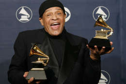 FILE - In this Sunday, Feb. 11, 2007, file photo, Al Jarreau poses with his awards for best pop instrumental performance for "Mornin'" and best traditional R&amp;B vocal performance for "God Bless the Child" at the 49th Annual Grammy Awards in Los Angeles. Jarreau died in a Los Angeles hospital early Sunday, Feb. 12, 2017, according to his official Twitter account and website. (AP Photo/Kevork Djansezian, File)