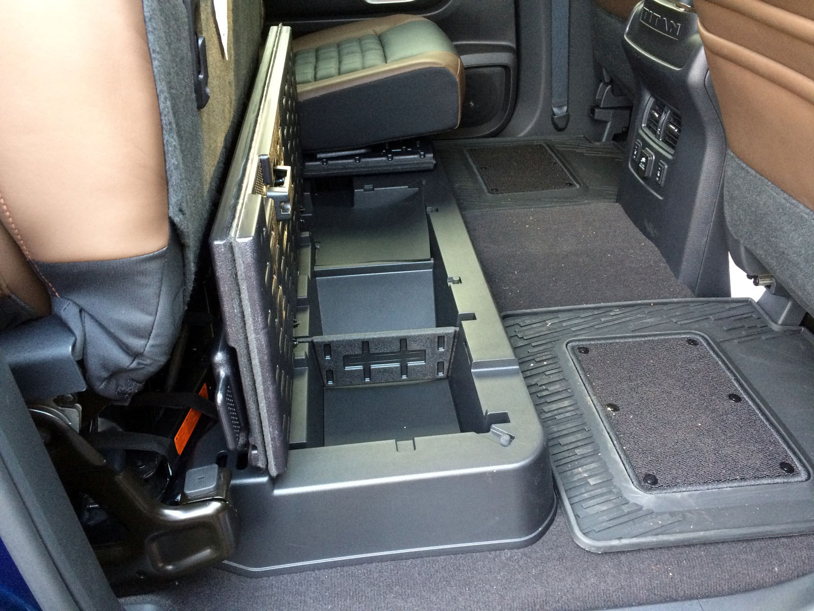 The truck includes some lockable storage under the rear bench, but the floor isn’t flat for larger, taller items like in some of the other trucks. There is a tray that lays down to a have a flat surface. (WTOP/ Mike Parris)