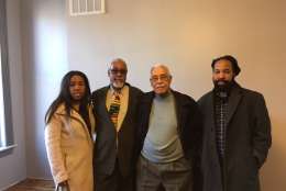 Robert Vest (3rd from left) worked for Dr. Woodson. He's in his 90s now. Pictured with son and grandchildren. (WTOP/Liz Anderson)