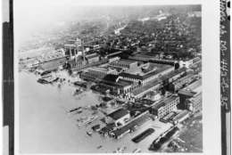 hotographic copy of an historic photograph (From the Navy Yard Historical Center). AERIAL VIEW OF THE NAVY YARD DURING THE 1936 FLOOD. VIEW LOOKING NORTHWEST. BUILDING 36, JUST RIGHT OF CENTER, CONSISTS OF THE EAST AND NORTH WINGS OF THE QUADRANGLE STRUCTURE. - Navy Yard, Ordnance Building, Intersection of Paulding & Kennon Streets, Washington, District of Columbia, DC