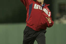 President Bush throws out the ceremonial first pitch between the Washington Nationals and Atlanta Braves for the start of baseball season at Nationals Park in Washington, Sunday, March 30, 2008. (AP Photo/Lawrence Jackson)