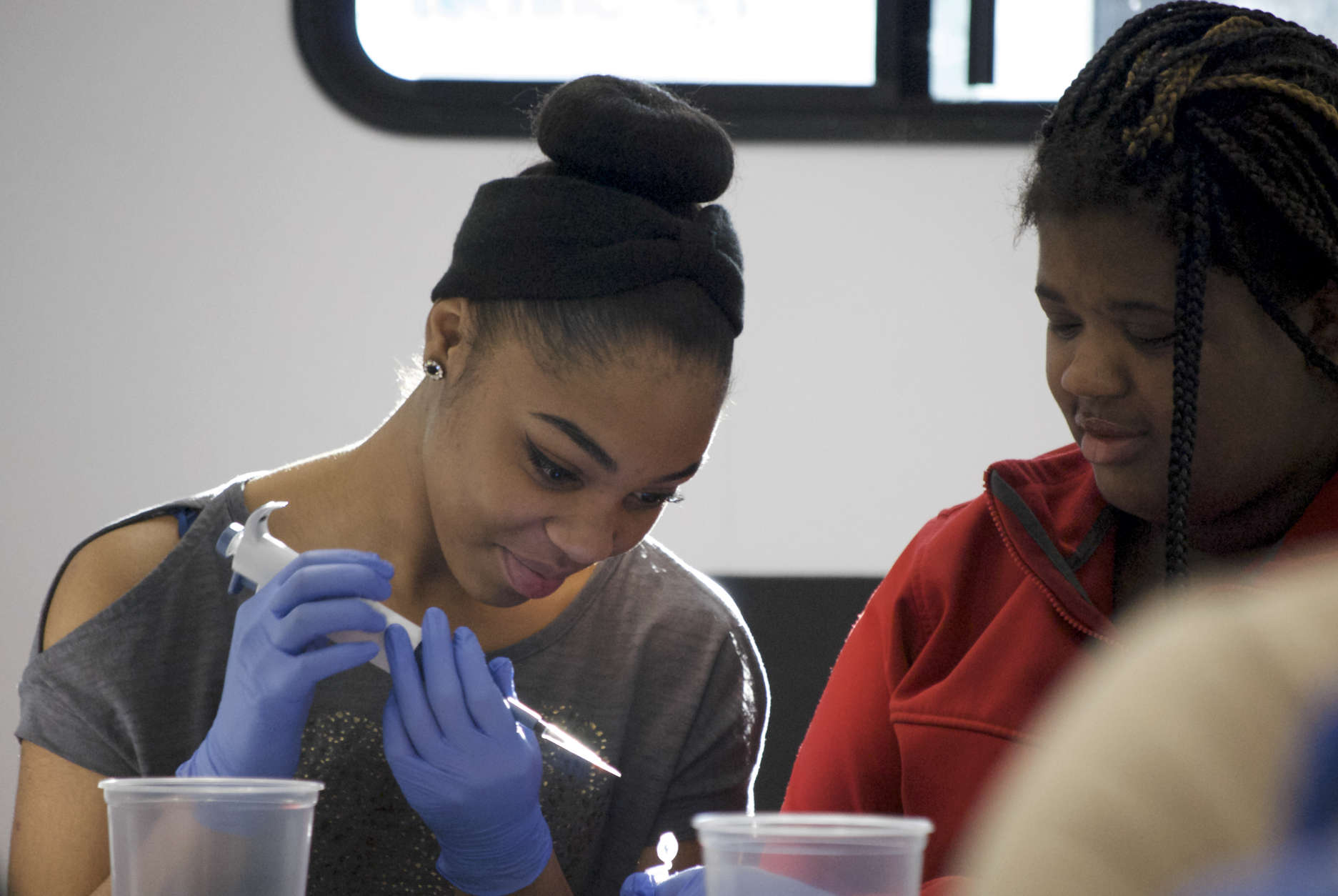 Students participate in a science activity inside the trailer. (Courtesy MdBio Foundation)