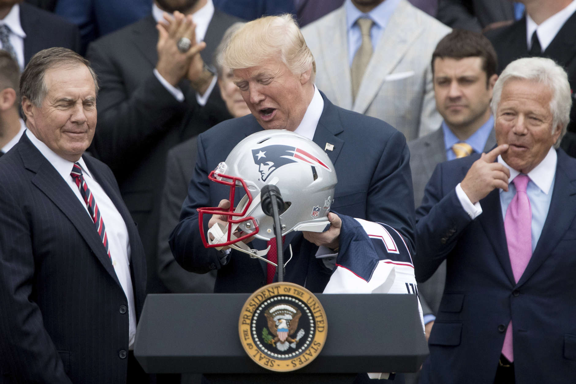 New England Patriots head coach Bill Belichick (left) and owner Robert Kraft presented President Donald Trump with a helmet and jersey during a ceremony to honor the Super Bowl champs April 19. (AP photo/Andrew Harnik)