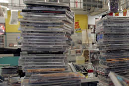Aron's Records owner Jesse Klempner sorts CDs before restocking them at the Los Angeles store Wednesday, Dec. 28, 2005. Sales of music albums in the United States fell about 7 percent in 2005 even as the number of singles purchased online more than doubled over last year, a mixed bag for the recording industry but little encouragement for embattled retailers. Aron's is going out of business after 40 years because of declining sales after a major competitor opened nearby, music downloading from the internet, and file sharing. (AP Photo/Nick Ut)